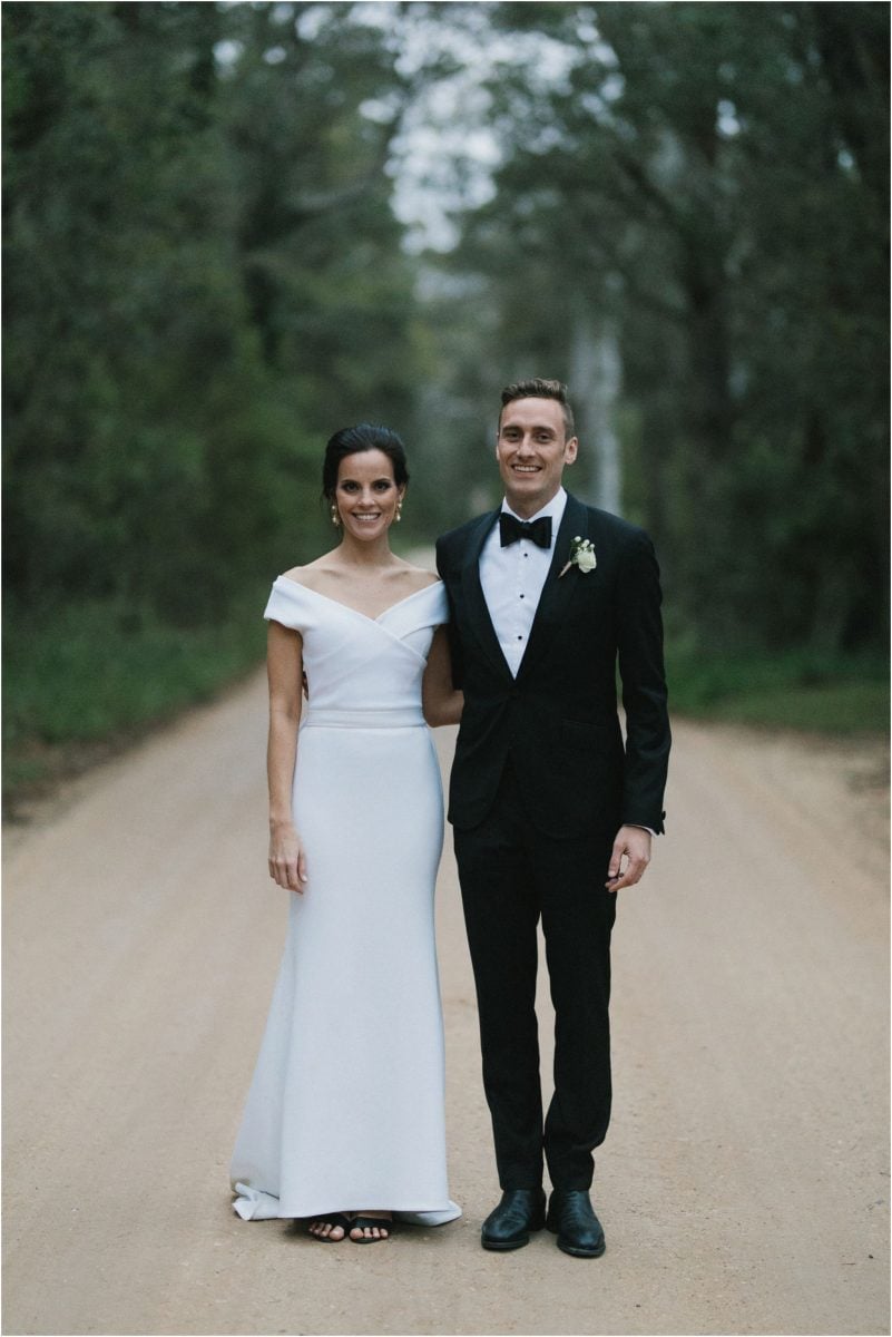 A newly married couple pose at their southern highlands marquee wedding