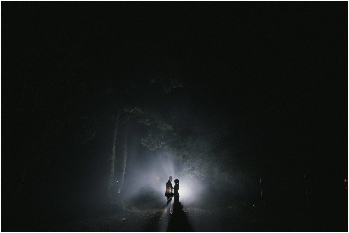 A newly married couple pose for a photo in the late night fog after their Allview Escape Blue Mountains Wedding