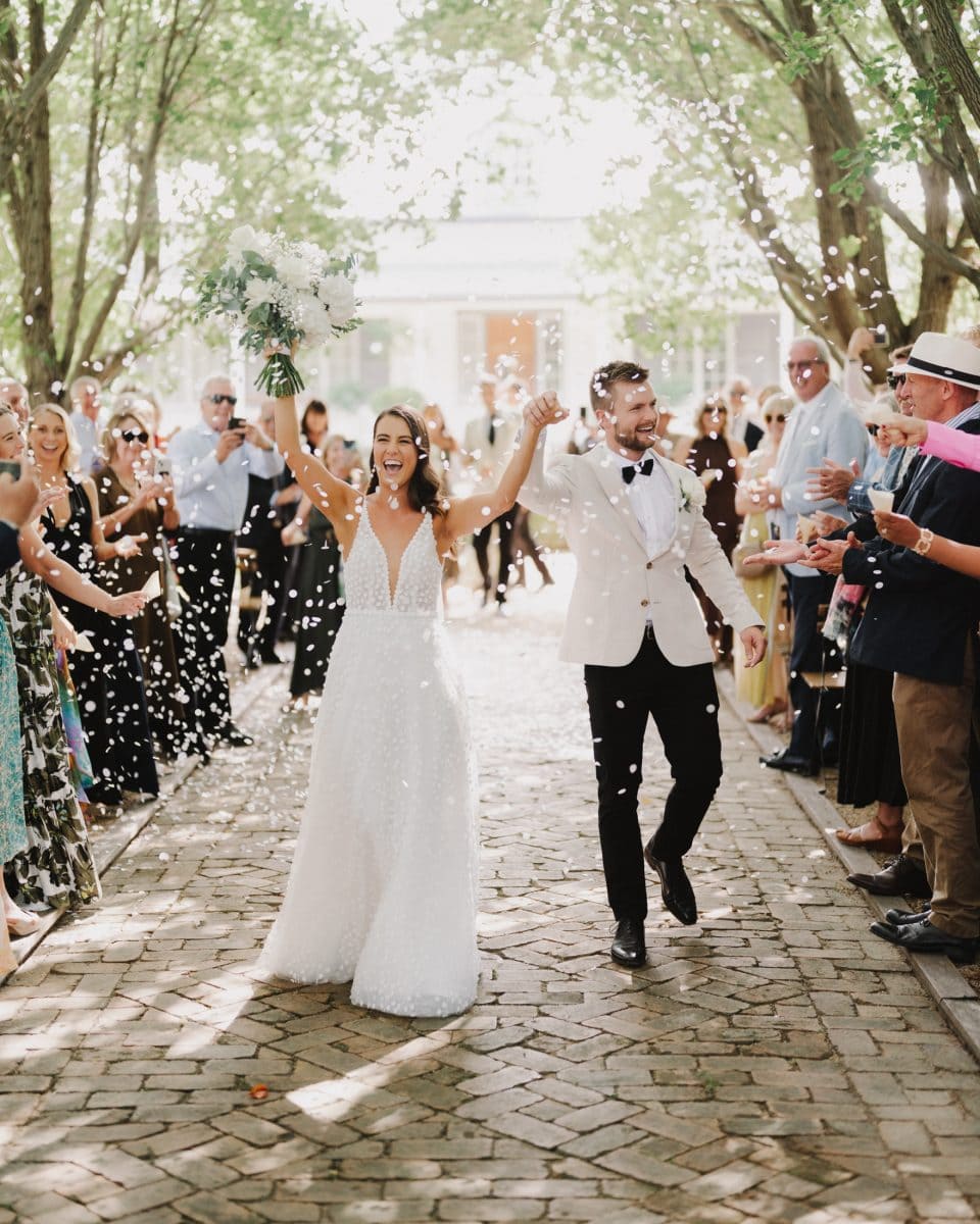 Southern Highlands wedding photographer Thomas Stewart took this incredible image of a couple walking back down the aisle at their wedding ceremony, being showered with confetti by their guests